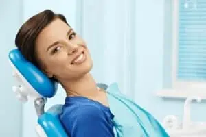 smiling woman in dental chair